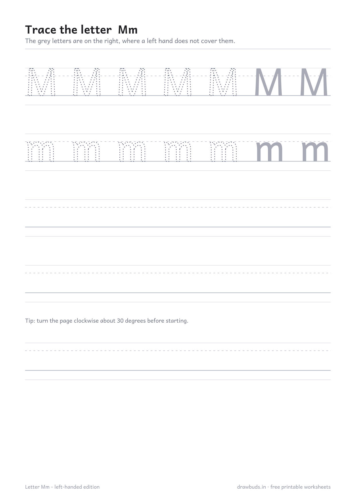Left-handed letter M worksheet with the paper-turning tip printed on the page